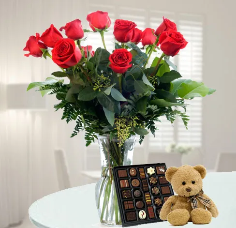 12 roses, chocolates and a teddy bear